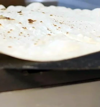 Fresh lavash bread on the saj